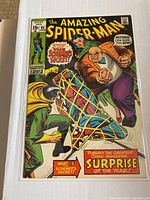 Front cover of The Amazing Spider-Man issue 85 showing Spider-Man trapped in yellow webbing with two villains battling.