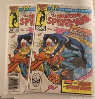 Two Amazing Spider-Man 275 comics showing both retail and hobby covers together