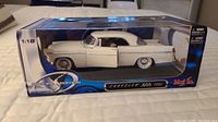Side view of white 1956 Chrysler 300 diecast model in Maisto Special Edition box with clear display window showing opened driver door.