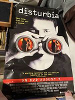 Photo of the original Disturbia movie poster showing main visual and text details.