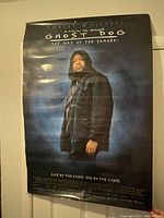Image showing the full movie poster featuring Forest Whitaker from Ghost Dog The Way of the Samurai in a dark hooded jacket, on a dark blue background.