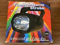Box of Thunderstorm strobe light with colorful branding and product photo.