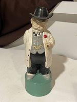 Front view of the Colonel Sanders ceramic decanter with hat on.