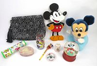 All items in the vintage Disney lot arranged together: baby Mickey plush, Loungefly purse, wooden Mickey cutout, kaleidoscope, snowglobe, glass, button, pencil, trinket box, pepper shaker, and more