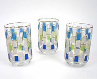 Set of three glasses showing geometric colored rectangular patterns and gold outlines.