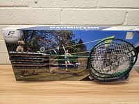 Full Eastpoint 4 Player Badminton Set box showing net, rackets, poles and base parts inside the packaging.