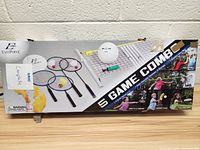 Front of box showing Eastpoint logo, partial set contents including rackets, ball, and net material.