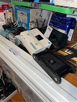 Overview of lot showing cameras, printer, paper and frames