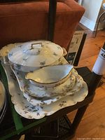 Overview of the stack showing large and small platters, covered dish, sauce boat and plate.