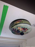 Top view of closed candy dish with hand-painted floral lid