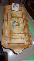 Full view of the rectangular handled platter showing the entire painted scene and platter shape.