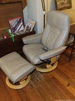 Front-left angle view of chair and ottoman