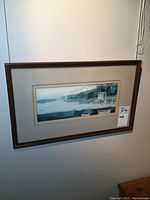 Photo of the entire framed watercolour painting on the wall, showing the full frame and artwork.