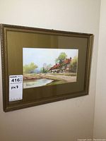 Framed watercolour painting hanging on wall, showing entire artwork and frame.