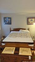 Frontal view of assembled bed showing headboard, mattress, and footboard