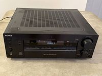 Front view of Sony STR-DB870 receiver showing its controls, display, and power button.