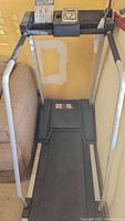 Full view of DP Fit For Life treadmill showing black running belt, gray frame, and console.