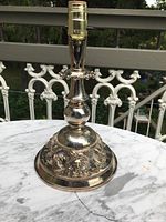 Full view of lamp base showing the top electrical fitting and overall shape.