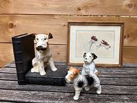 Overview of the vintage dog-themed bookend, three dog figurines, and small framed print titled 'Pals' arranged together