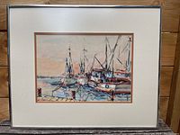 Framed watercolour print showing multiple docked sailboats with detailed masts and reflections on water.