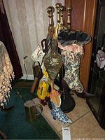 Full view of fireplace tool set with Victorian boot match holder, ceramic match boot, copper bucket, wooden bellows, Duraflame firelog, and box of matches