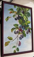 Framed oil painting featuring plums and leaves on branches against a blue sky, signed S Routhier 1925