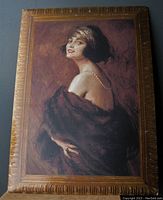 Front view of framed Art Deco lady advertising poster for chocolate store.