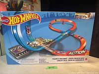 Front of box displaying Hot Wheels Figure 8 Raceway set and price tag $19.99