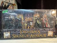Front view of the unopened collectible figurine set in original packaging showing five characters.