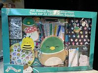 The open box packaging showing all included Squishmallows themed stationery and accessories inside.