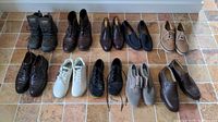 Full overview of 10 pairs of men's shoes including hiking boots, dress shoes, sneakers, casual shoes in mixed colors.