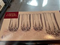 Box of 4 Cristal d'Arques Paris clear crystal water glasses with cut-glass base pattern.
