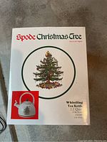 Box showing Spode Christmas Tree Christmas whistling tea kettle, 2.2 quart porcelain enamel on steel