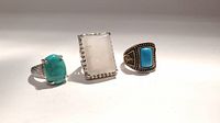 Photo showing all three rings side by side on a white background