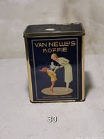 Front view of the rectangular Van Nelle's coffee tin showing retro illustration of woman pouring coffee to a child.