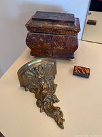 Overview showing jewelry box, brass sconce bracket, tortoiseshell box