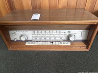 Front full view of NordMende 3004C radio tuner amplifier in wooden cabinet.