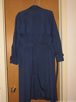 Navy London Fog trench coat full length showing back side with belt and buttoned cuffs