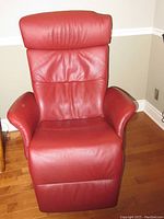 Front view of the red leather recliner in upright position.
