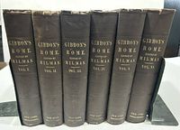 Six hardcover volumes of The History of the Decline and Fall of the Roman Empire set, spines showing titles and volumes.