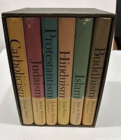 Photo of the complete boxed set showing all six books in slipcase with titles visible.
