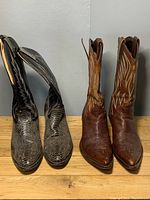 Front and side view of both pairs of cowboy boots showing the full height and designs.