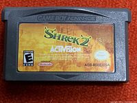 Front of the Nintendo Game Boy Advance cartridge showing the Shrek 2 label and Activision branding.
