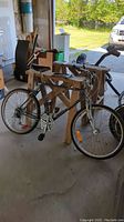 Side view of the entire bicycle showing frame, tires, and attached lock.