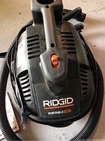 Top view of Ridgid Portable Vac unit showing brand and power switch
