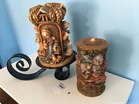 Photo showing both decorative German beeswax candles and metal holder details