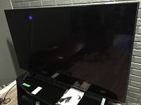 Front view of TV on stand