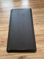 Top view of the black cushioned kitchen mat showing full surface and rectangular shape.