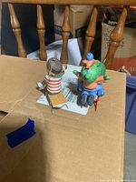 Top rear angle view showing individual sled ornament and two child sled ornament from side and rear.