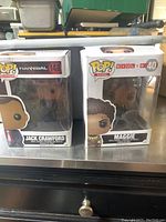 Both Jack Crawford and Maggie Funko Pop figures in their original boxes.